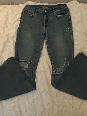 Arizona Jean Co. distressed low-rise flared jeans